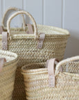 Set of woven baskets with handles